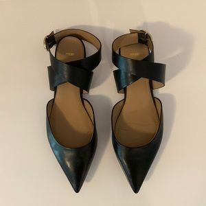 Pointy black flat shoes